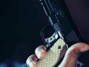 Feature | holding a gun | Gun Control Won't Solve the Problem In The USA [Video] | pro gun control