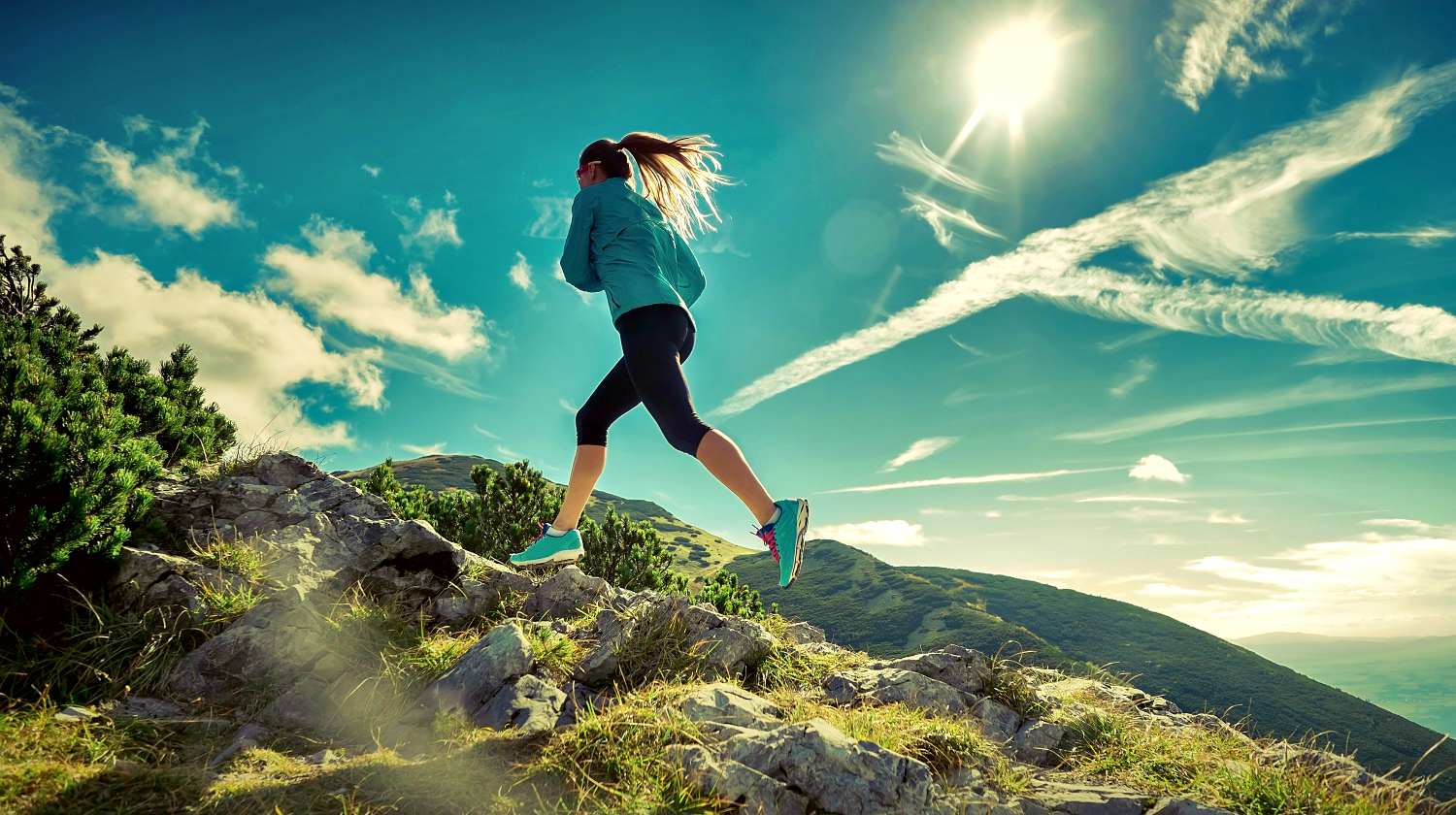 Featured | Female running in mountains under sunlight | Running Zigzag: Is It Actually Effective In Threat Evasion?