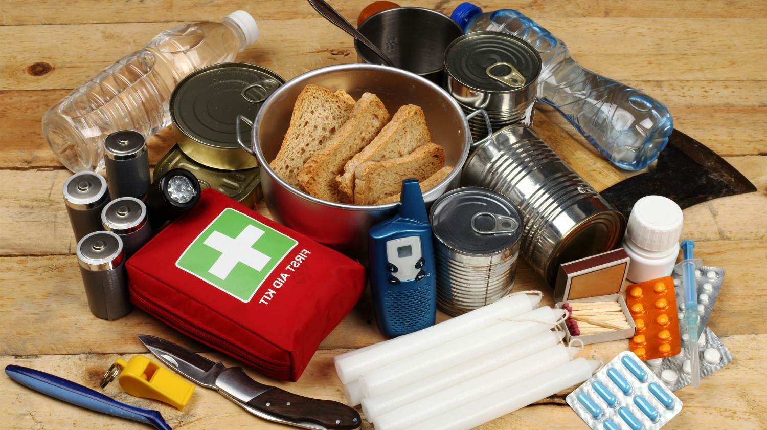 Feature | Items of emergency on wooden table | Everyday Uses For Your Emergency Survival Kit