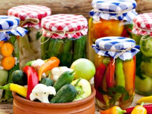Jars with pickles, green tomatoes, cayenne pepper, mixed salad and chillies | Canning Tips To Make Food Last For A Long Time | Featured