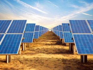 Solar panel farm lined up under the sky | Why You Need To Try Solar Power | Featured