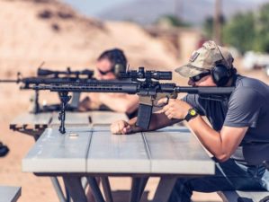 man firing black rifle on desert rifle shooting tips ss