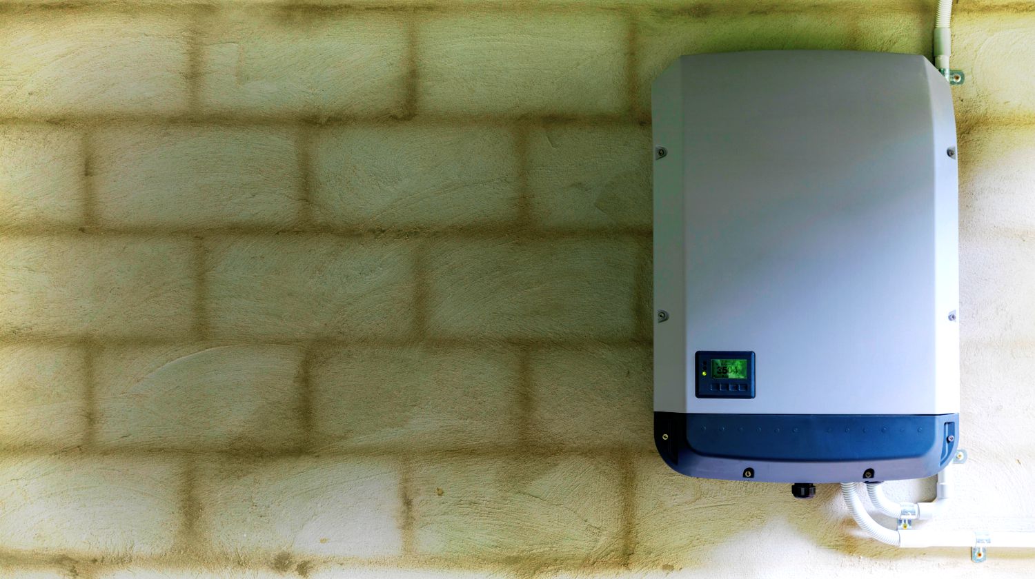 Feature | Solar power inverter mounted on brick wall inside garage | A New Take On Alternative Energy: The Tesla Powerwall