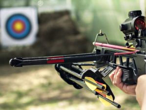 Featured | The shooter directed the crossbow towards the colored target | Crossbow Shooting 101: How To Improve Your Shooting Skills