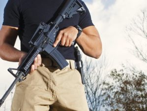 man carrying AR15 rifle | Why The AR15 Is One Of The BEST Firearms You Could Ever Buy | AR15 | ar 15 parts | Featured