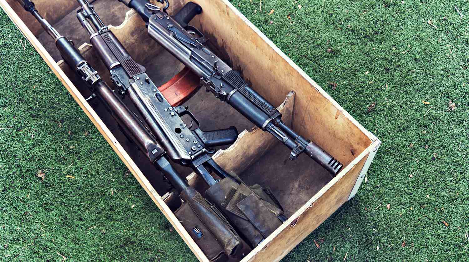 Featured | An automatic weapon with a sniper scope in wood box | Hidden Gun Storage Ideas | Picture Frame Gun Storage & More