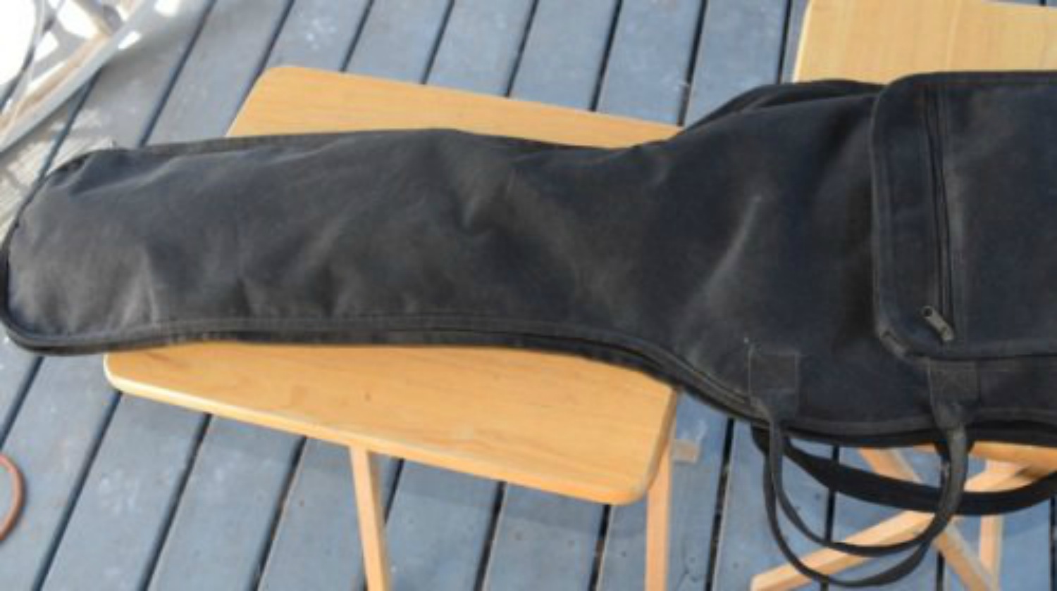 bass guitar case on table | An Alternative To Leaving Your Gun In Your Car Or Truck At Night | leaving your gun in the car | car gun safe | Featured