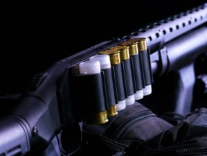 Shotgun, shotgun cartridges on a black background | The Best In Home Defense | Mossberg 500 Tactical | Featured