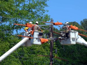 A crew of men working on a power line during a power outage.