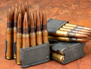 World war II M1 clips and 30-06 ammunition on rusty background | Modern Shooter: .30-06 Springfield | Featured