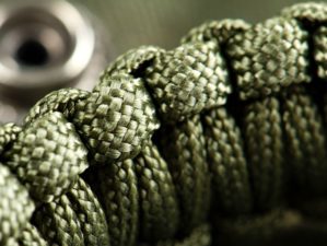 Closeup braided green paracord bracelet | How To Make A Paracord Belt To Stay Prepared [Video] | Featured