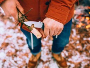 man uses knife whittle stick out pocket knives feature ss