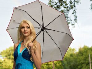 Portrait of the beautiful blonde girl with white umbrella in blue dress | Deadly Parasols | Umbrella As A Self-Defense Weapon