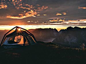 Feature | Tent in the middle trail top view of sunrise and mountain | Things You Need to Live Off the Grid