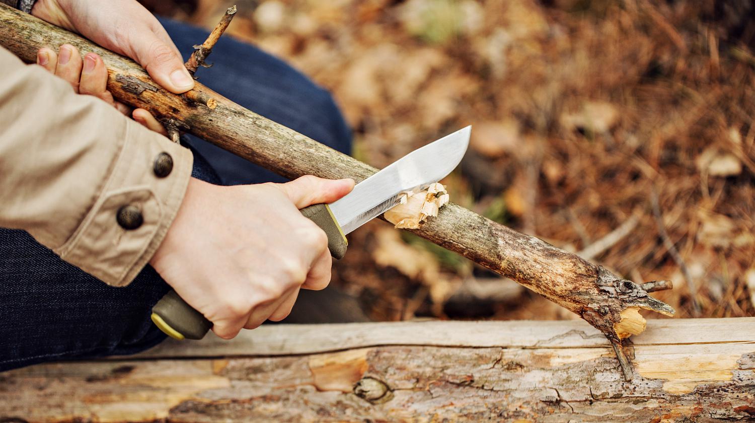 Feature | Man cuts a stick a knife in the woods | Obscure Bushcraft Skills For Survival