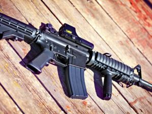 Feature | Rifle on a wooden surface | Gun Modifications | AR-15 Dos and Don'ts