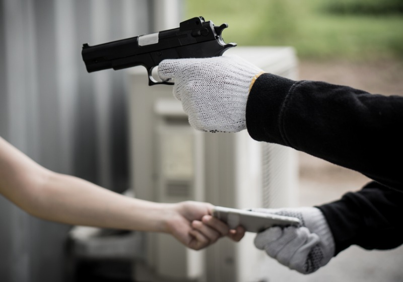 dangerous city robber pointing gun victim | gun to head