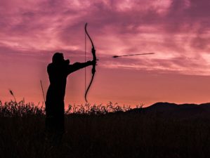 Feature | Silhouette of archer holding her bow and arrow | How To Practice For Bow Hunting