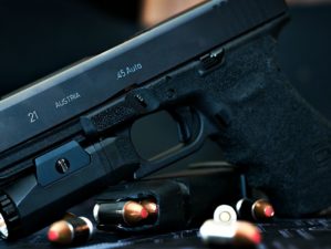 Feature | Glock 21 handgun with flash light and hollow point bullets | Mastering The Glock Trigger