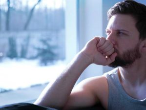Feature | Man looking at the window | Surviving Sleep Deprivation