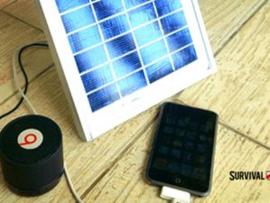 cellphone and speaker charging on solar panel | DIY Solar-Powered Cellphone Charger | diy solar-powered | solar panel | Featured