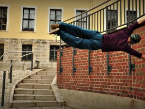 Acrobatics-action-adult | Is Parkour Training A Survival Skill Or Just A Fad Exercise? | Featured
