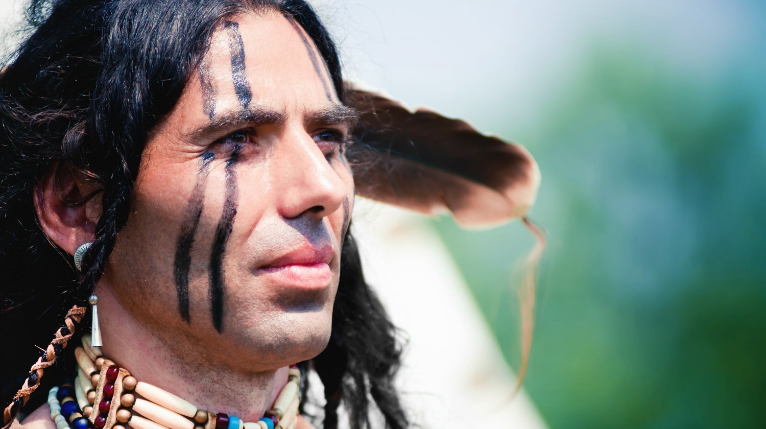 Featured | Portrait of american indian in national dress | Native American Survival Tips | What You Can Learn From These Experts