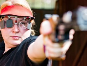 Featured | Woman concentrating on sport shooting training | How To Fix The Top Pistol Shooting Errors: Part One