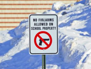 Feature | No firearms allowed on school property sign outside a school in the snow | No Guns Allowed Signs | What A Responsible Gun Owner Can Do
