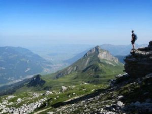 Feature | Man standing in top of the mountain | Amazing Hiking Trails You Have To See To Believe