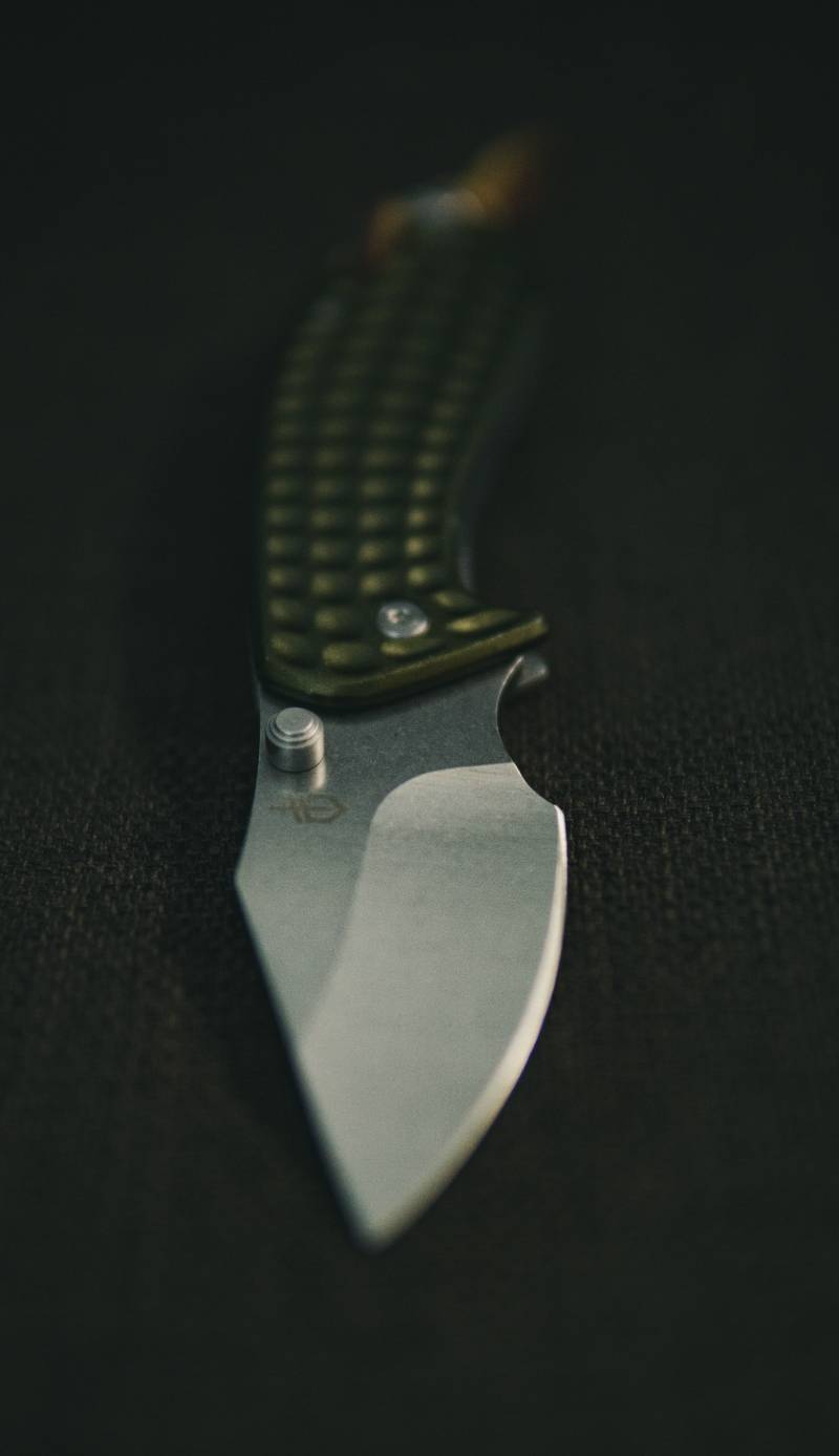 silver pocket knife on black textile | Nevada Knife Laws