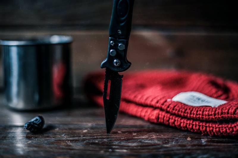 black and silver knife on brown wooden table | Colorado Knife Laws