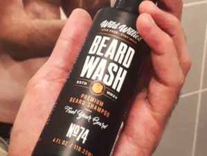 Feature | male holding Wild Willies beard shampoo beard wash | Top Beard Wash Ingredients And What They Do