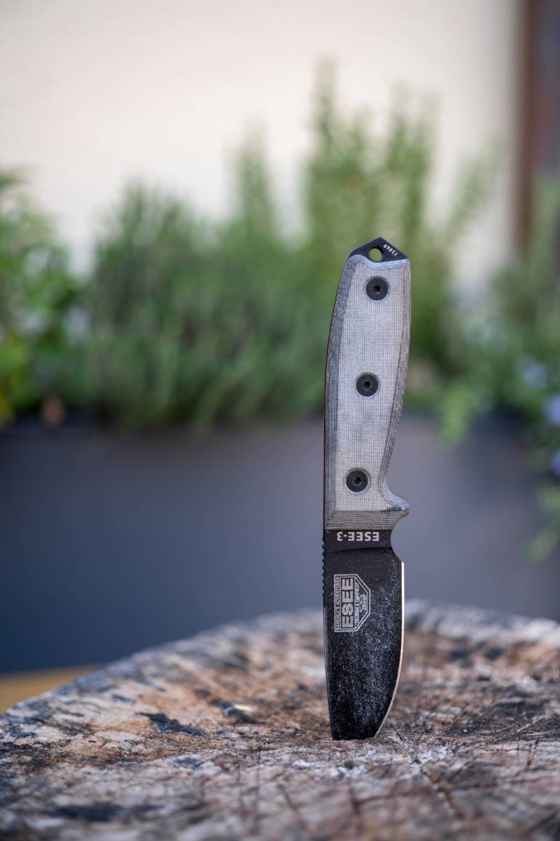 black and silver pocket knife on brown wooden table | Alaska Knife Laws