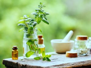 Feature | Essential Oil Peppermint Bottle on wooden table | Survival Uses For Peppermint Oil