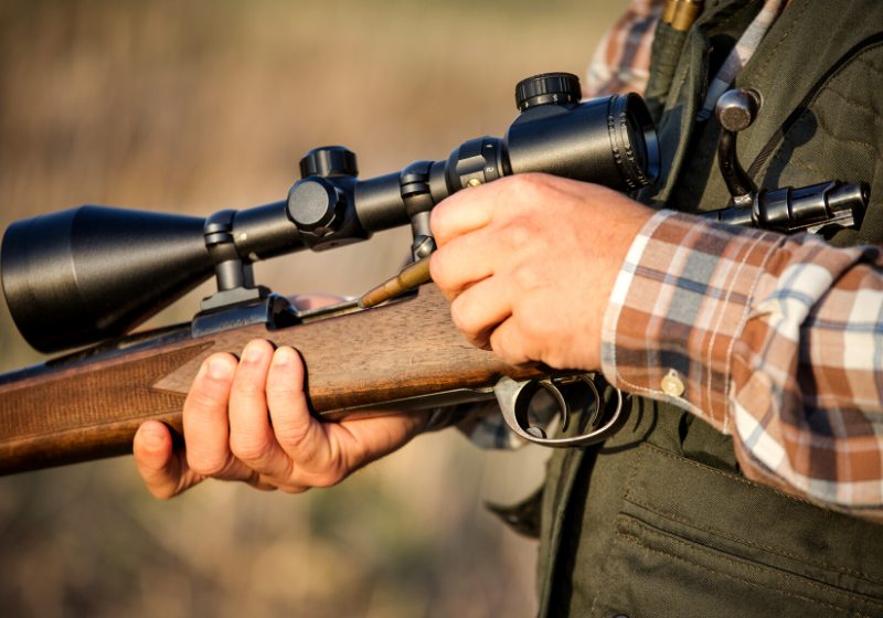 hunter holding rifle | norinco sks magazine