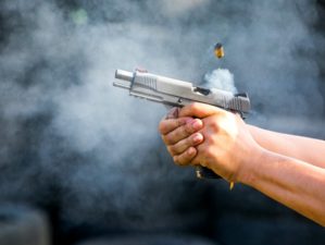 shooting pistol reloading gun man aiming | How to Treat a Gunshot Wound | Types of Gunshot Wounds (NSFW) | featured