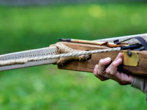 A man with crossbow in the woods | DIY Survival: How To Make A Crossbow From Scratch [Video] | Featured