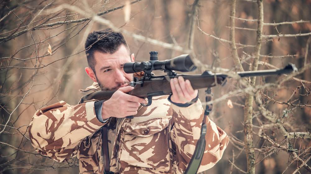 man-holding-sniper-shooting-on-open long range | Finally: Best Budget -Friendly Long Range Hunting Rifles | Featured