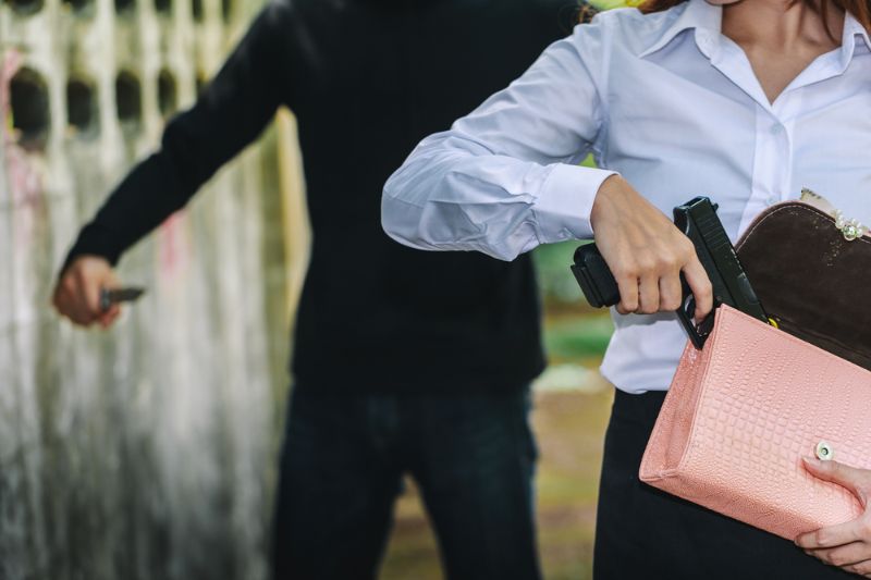 woman-pulls-gun-her-swanky-purse woman concealed carry