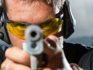 man aiming for a shoot | Best Handgun for Beginners 2016 | Best Handguns For The New Shooters | Featured