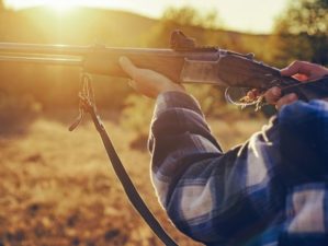 Hunter with shotgun gun on hunt | Best Defense Pistol Grip Shotgun | Featured