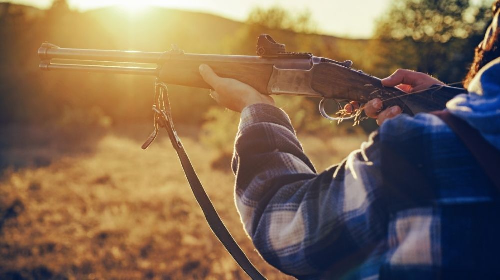 Hunter with shotgun gun on hunt | Best Defense Pistol Grip Shotgun | Featured