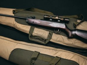 Rifle with scope in brown bag | Best Survival Rifles You Can Get for Under $500 | featured