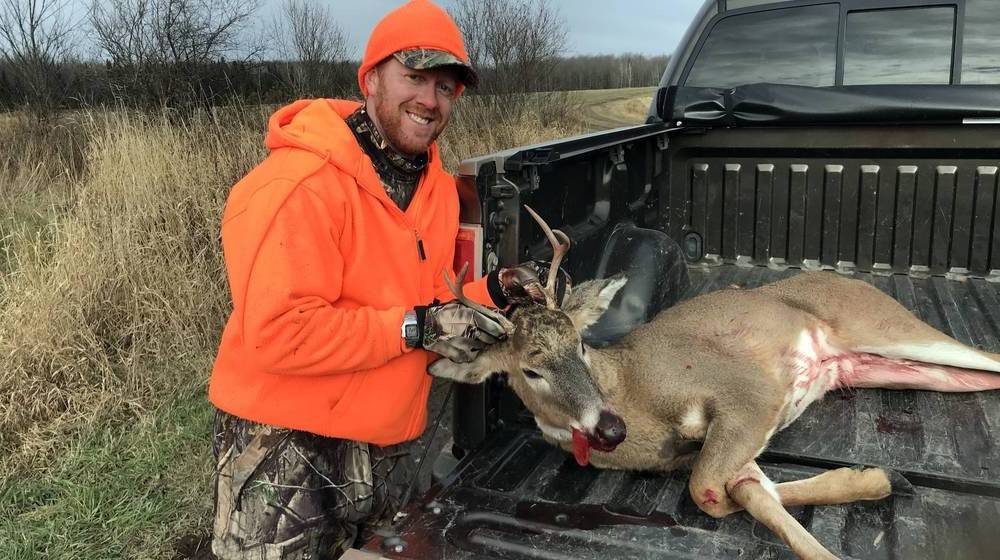 happy-hunter-whitetail-buck-harvested-wisconsin | Where To Shoot A Deer? 9 Ethical Kill Placements You Need To Know | Featured