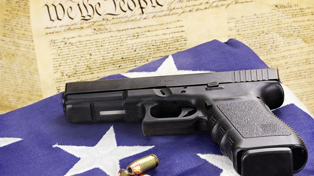 45-caliber-handgun-ammunition-resting-on | Our 2A Rights Under Assault? | Gun Freedom Radio [LISTEN] | Featured