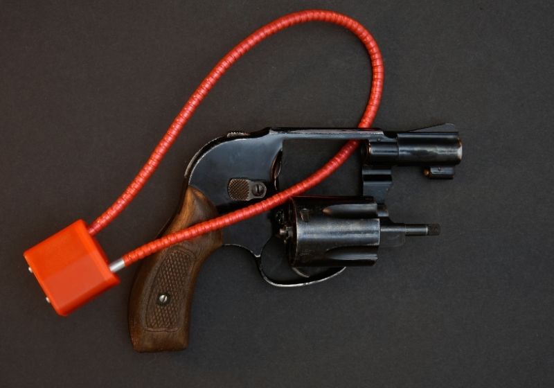 Black snubnose revolver with cable lock Gun lock SS
