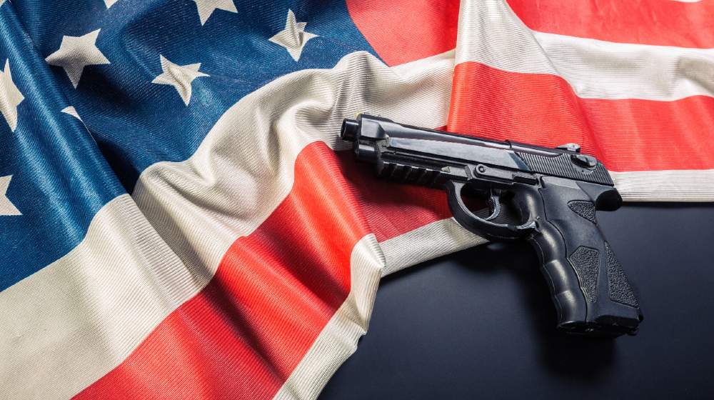 Handgun lying on American flag-Gun Control Bills-ss-featured