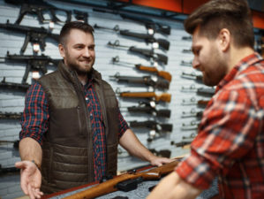 Man and owner choosing rifle in gun shop | How To Buy A Gun? # Basic Tips | featured