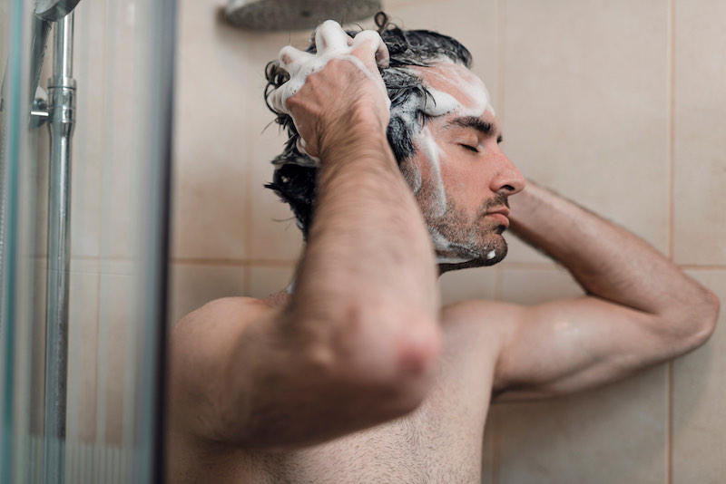 oung single handsome caucasian man are taking shower in the bathroom | bear hunting magazine